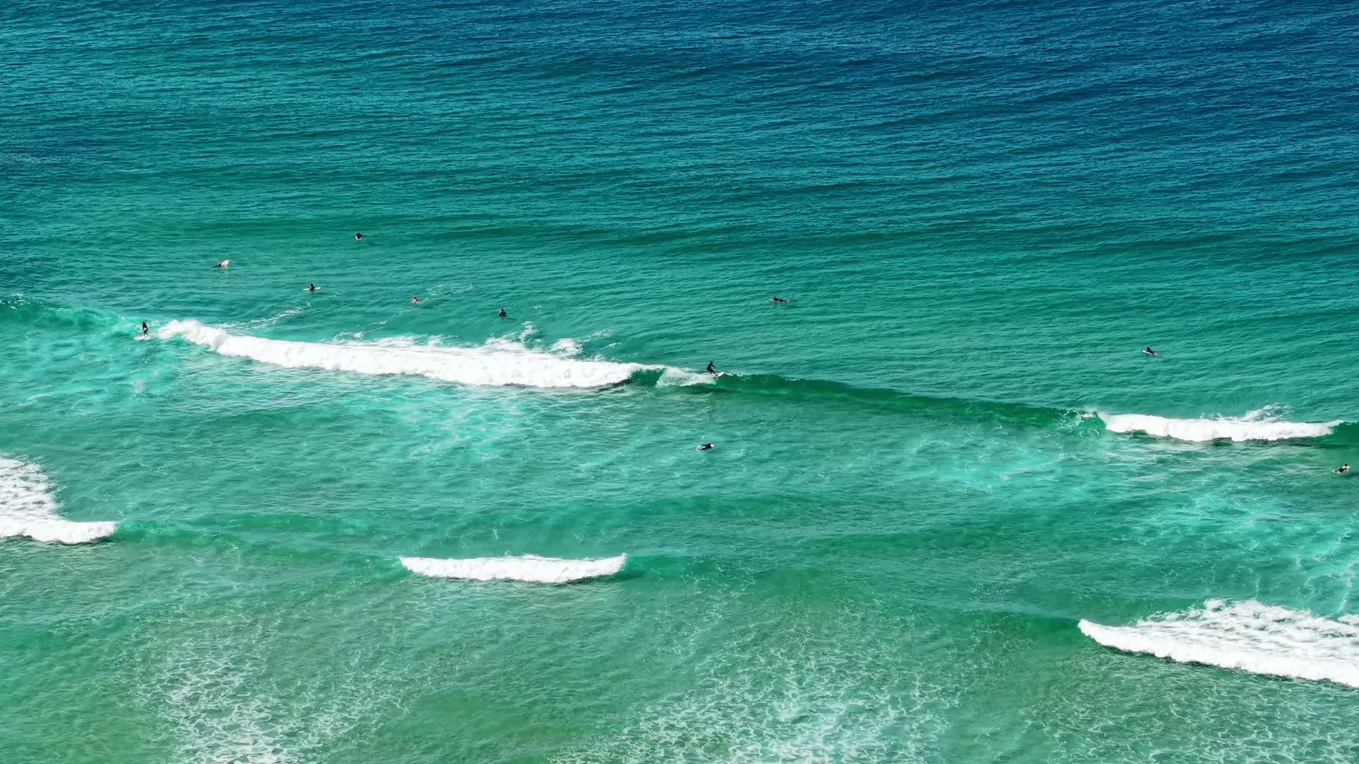 Surfers on the waves at Sawtell